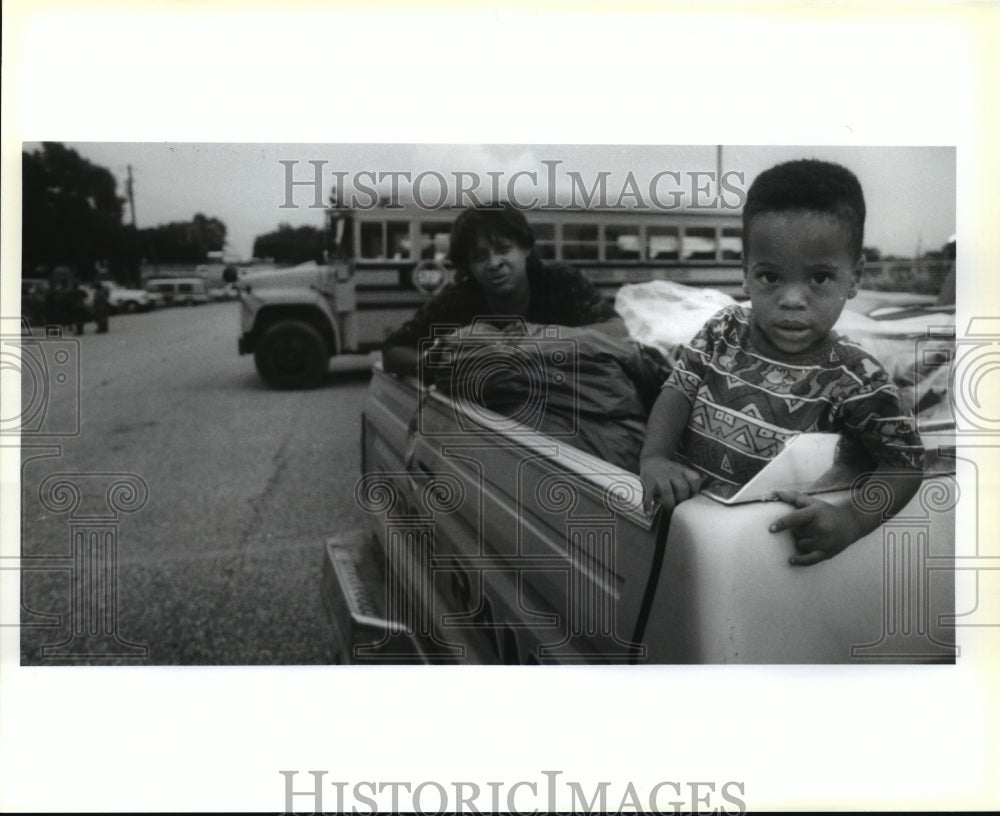 1992 Hurricane Andrew- Lisa Taylor goes through bag of belongings.-Historic Images