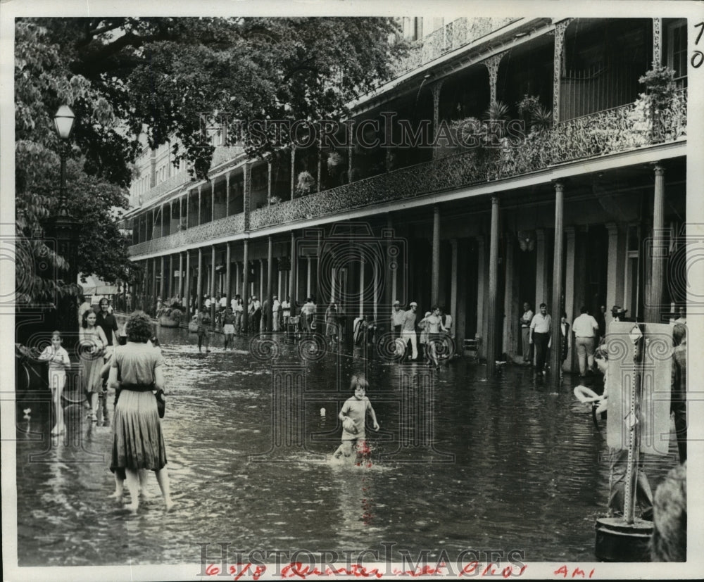 1981 People Playing in Water of Flooded Jackson Square - Historic Images