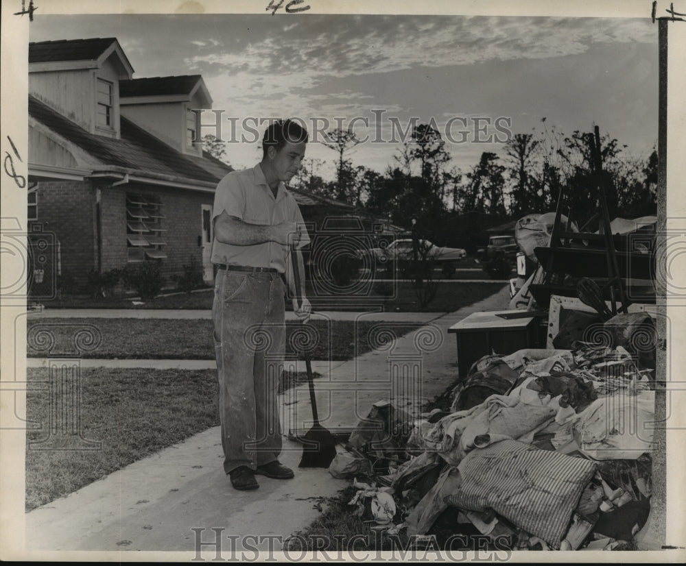 1965 Hurricane Betsy-John Meyer of Carolyn Park sweeps sidewalk - Historic Images