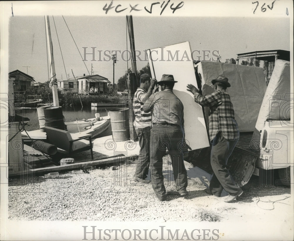 1964 Men Load Furniture and Refrigerator on Shrimpboat for Delivery - Historic Images