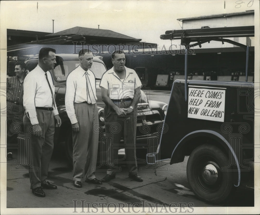 1957 Hurricane Audrey-Convoy of trucks departs to give aid. - Historic Images