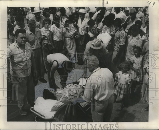 Expectant mother receiving aid.-Historic Images
