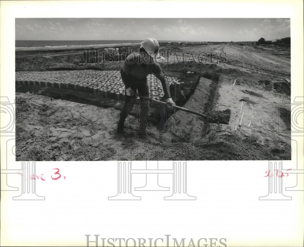 1991 Louisiana Wetlands- Dave Blackburn scoops material from MRGO. - Historic Images