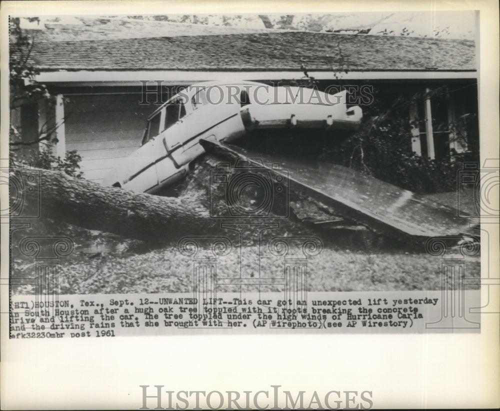 1961 Hurricane Carla- Car gets unexpected lift yesterday. - Historic Images