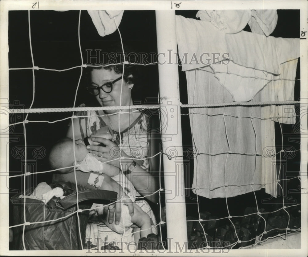 1957 Hurricane Audrey - Mrs. Willis Sylvester Safe with Baby Hector - Historic Images