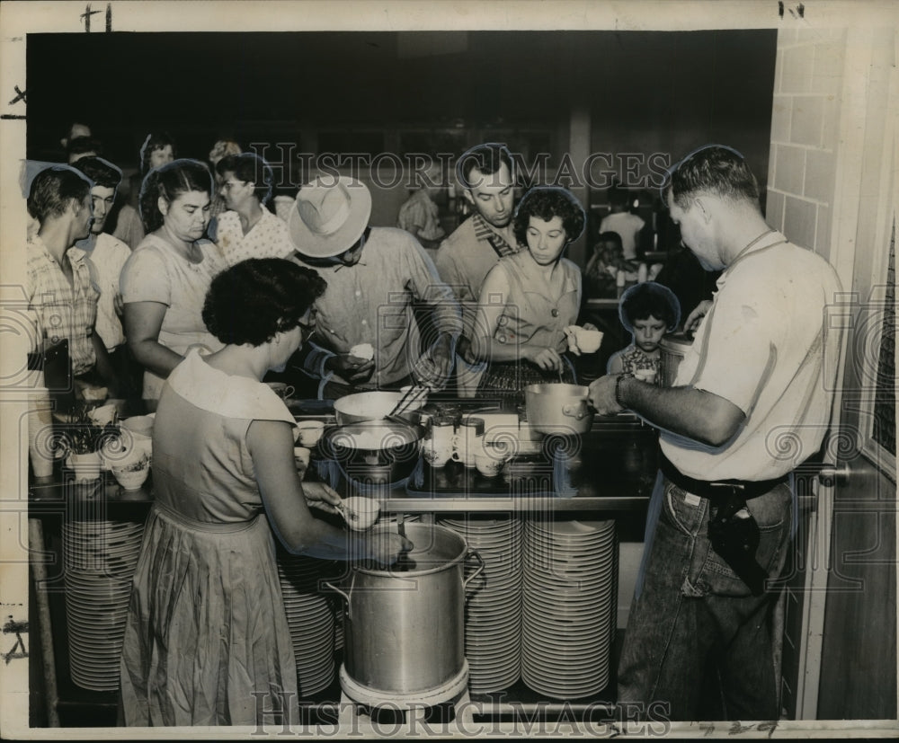 1960 Hurricane Ethel- Refugees get hot meal at Chalmette Gym. - Historic Images