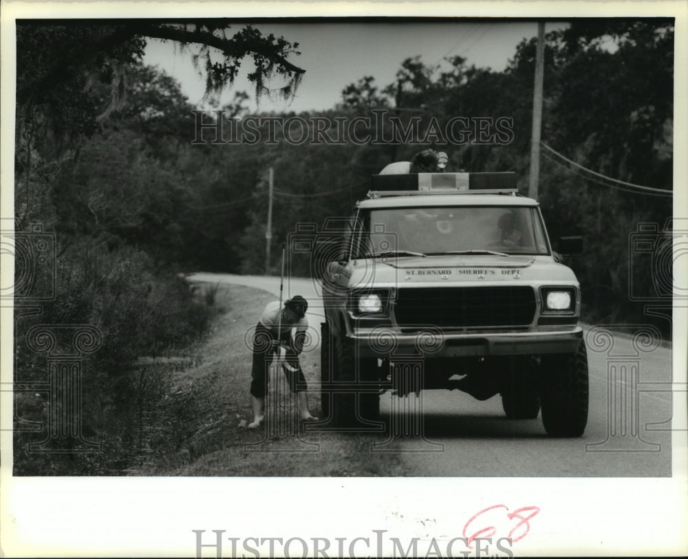 1988 Hurricane Florence- Marking roadway with depth markers. - Historic Images