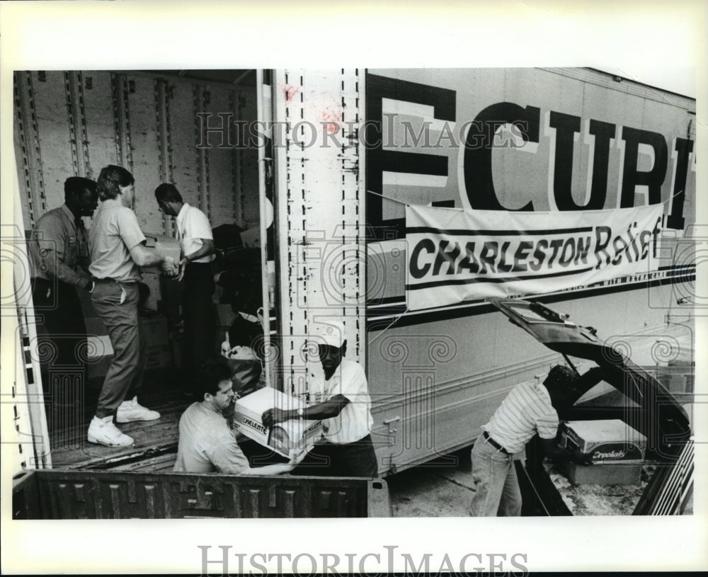 1989 Floyd Niette, Ray Alford &amp; Osacr Jiles after Hurricane Hugo - Historic Images