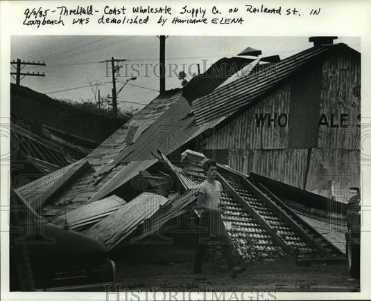 1985 Press Photo Hurricane Elena- Coast Wholesale Supply Co demolished. - Historic Images
