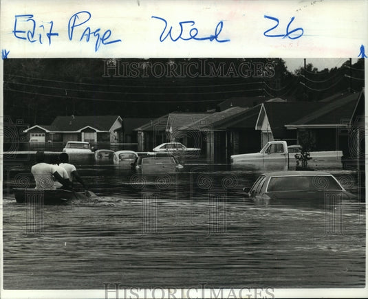 1985 Hurricane Juan- Flooding leaves flatboat as transportation. - Historic Images