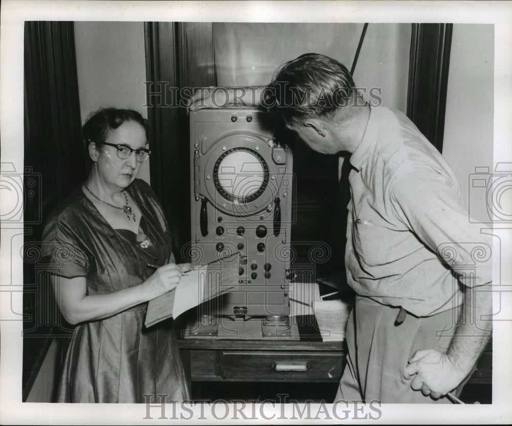 1956 Press Photo Hurricane Flossy- Checking equipment. - noa05137-Historic Images