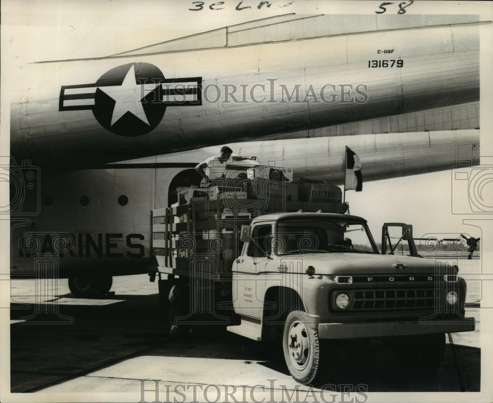 1965 Hurricane Betsy- Relief supplies being unloaded. - Historic Images