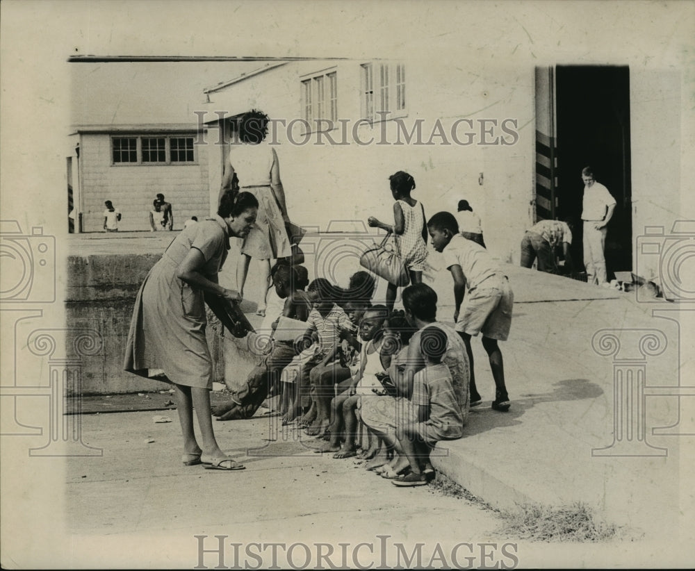 1965 Hurricane Betsy- Classes continue outside. - Historic Images