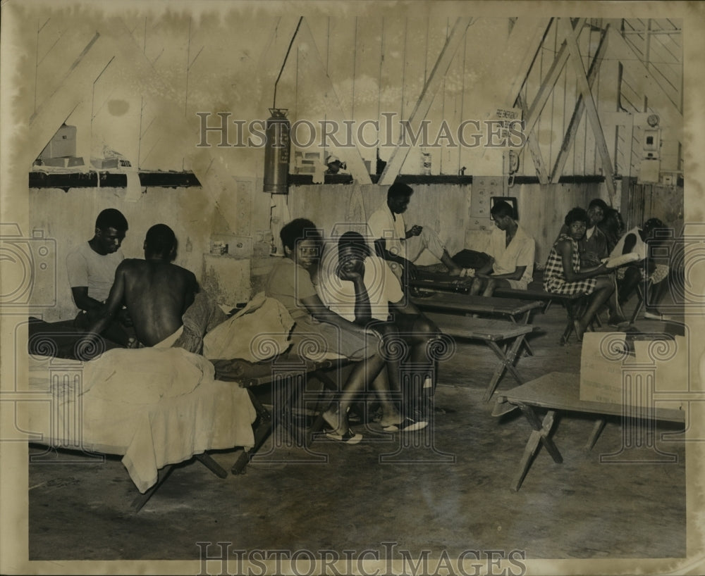 1965 Hurricane Betsy- Refugees taking it easy at shelter. - Historic Images