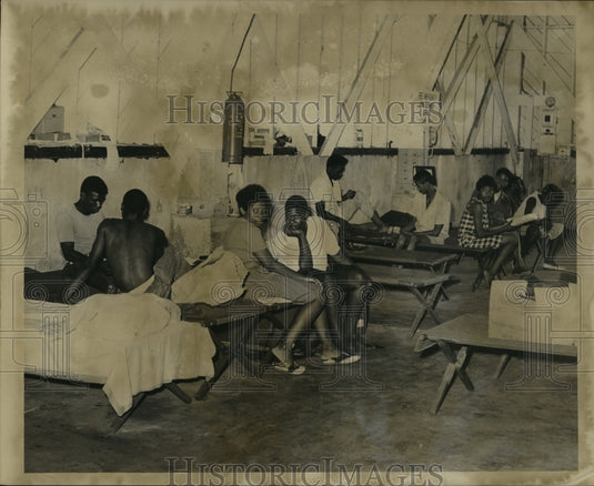 1965 Hurricane Betsy- Refugees taking it easy at shelter. - Historic Images