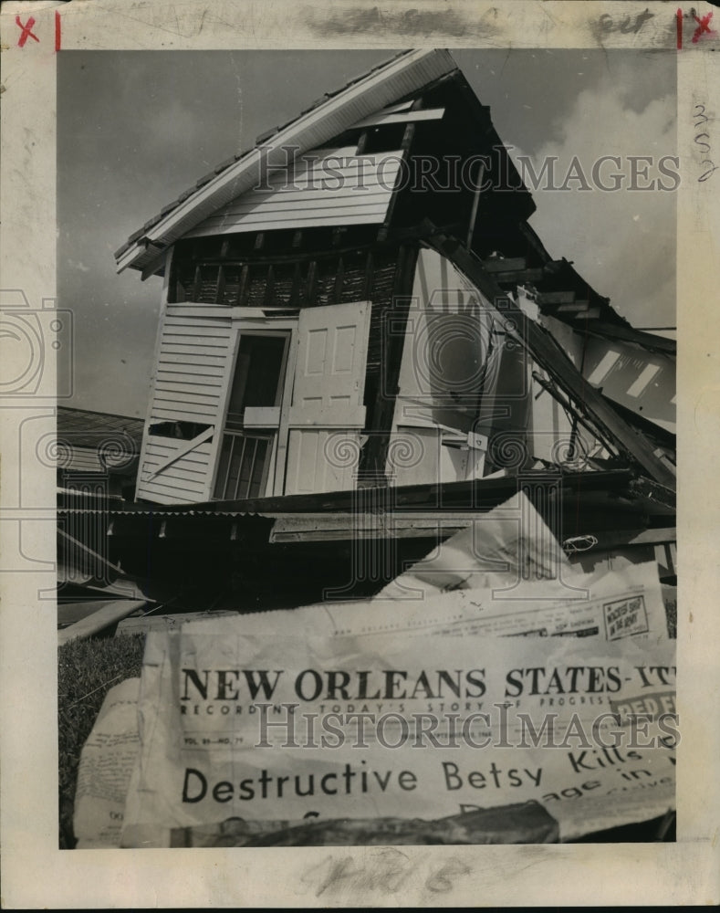 1965 Hurricane Betsy-Fridays States Item headline against wreck. - Historic Images