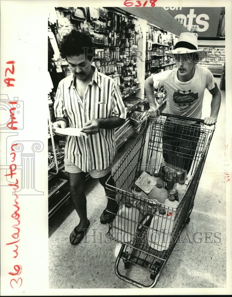 1985 Hurricane Elena Walter Litchfield &amp; Andrew Ludwig shopping - Historic Images