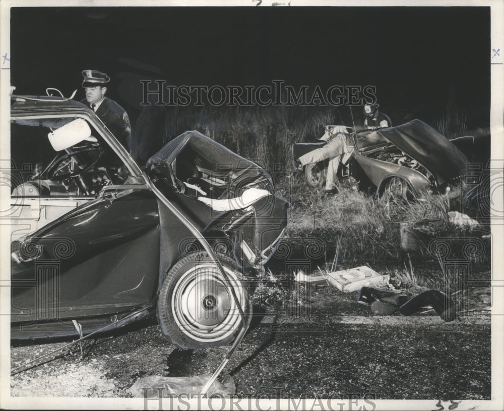 1967 Accidents- Investigators search wreckage where woman was killed - Historic Images