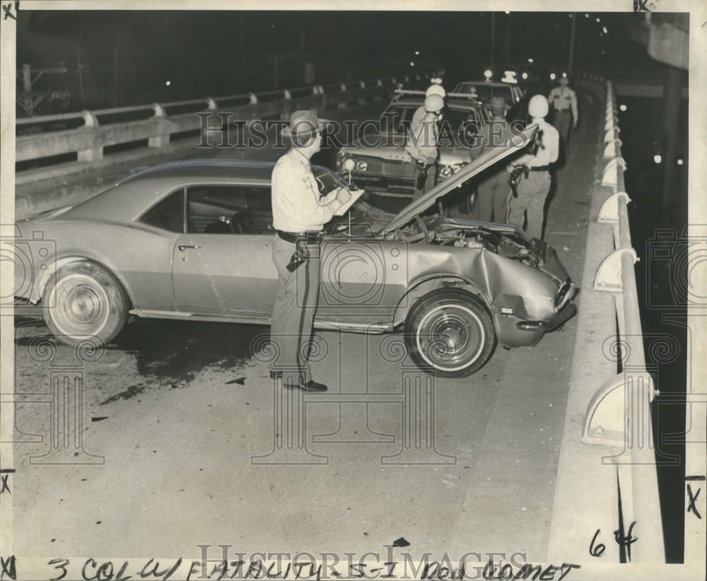 1968 Accidents- Troopers investigate N. Causeway fatality. - Historic Images