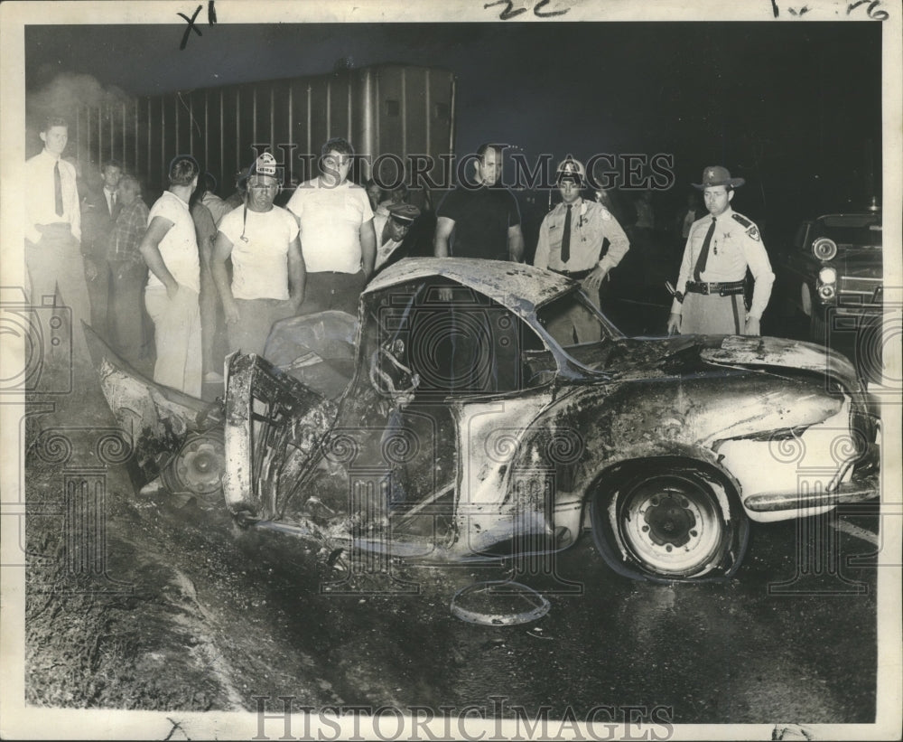 1968 Firemen by car crash on Airline Highway near Kenner overpass - Historic Images