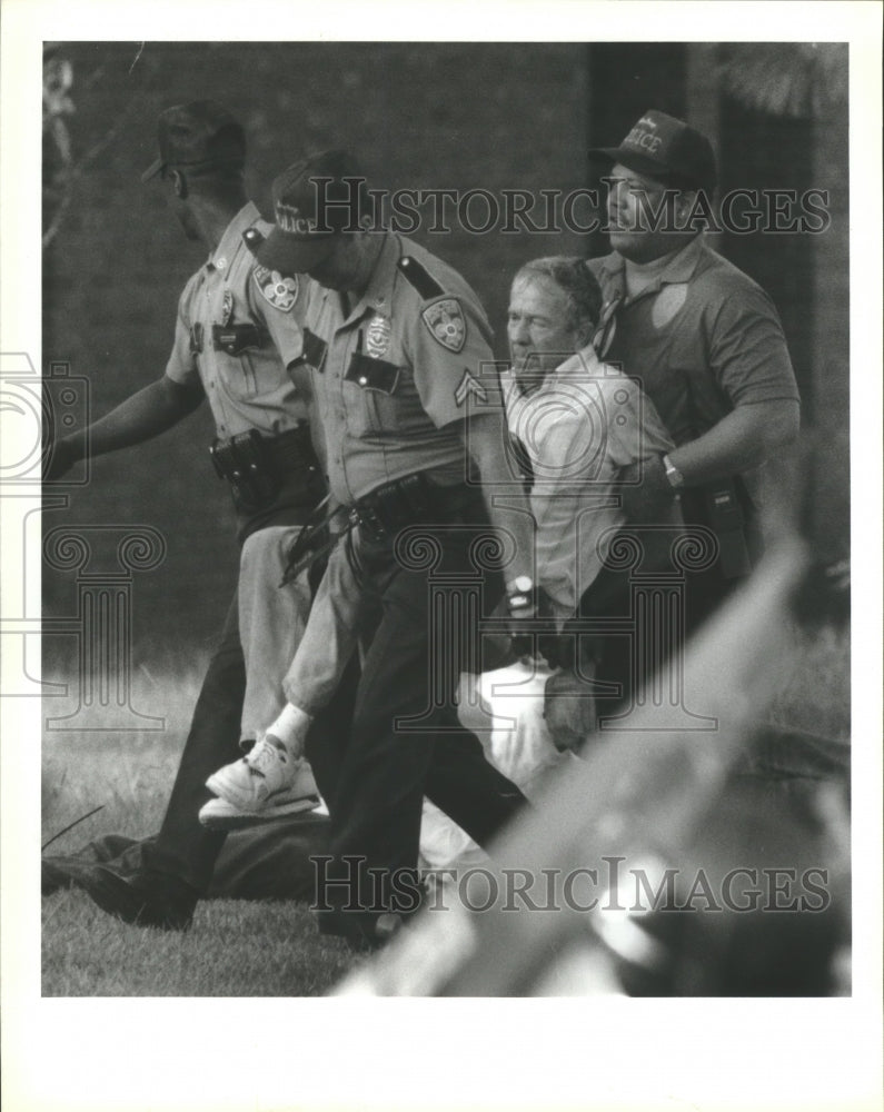 1992 Operation Rescue Abortion Group Member Carried by Police - Historic Images