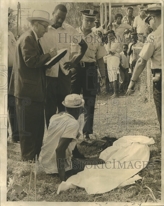 1966 Accidents- Grief stricken father sits by daughters body. - Historic Images