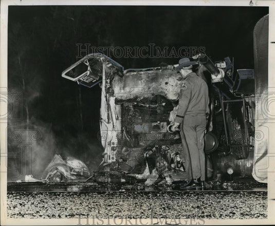 1966 Accidents- Parts of compact car scattered at scene of collision - Historic Images
