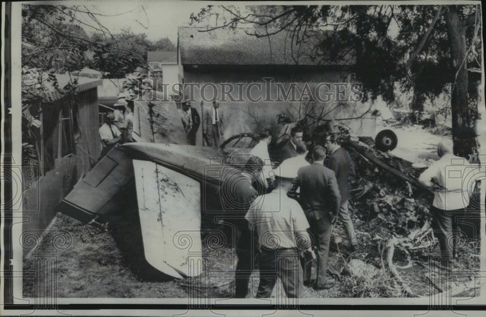 1968 Airplane Accidents- Investigators explore wreckage of plane. - Historic Images