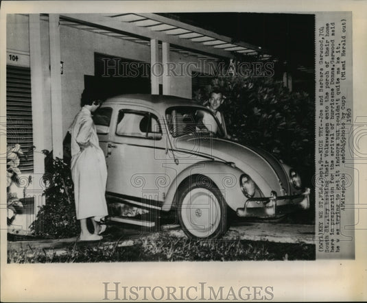 1960 Hurricane Donna-Joe and Barbara Garwood back car onto porch. - Historic Images