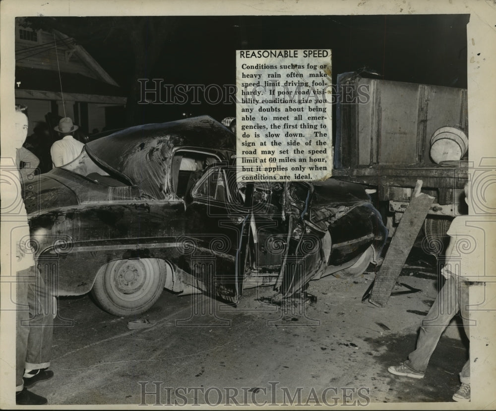 1956 Accidents-Badly damaged auto rests behind truck it crashed into - Historic Images