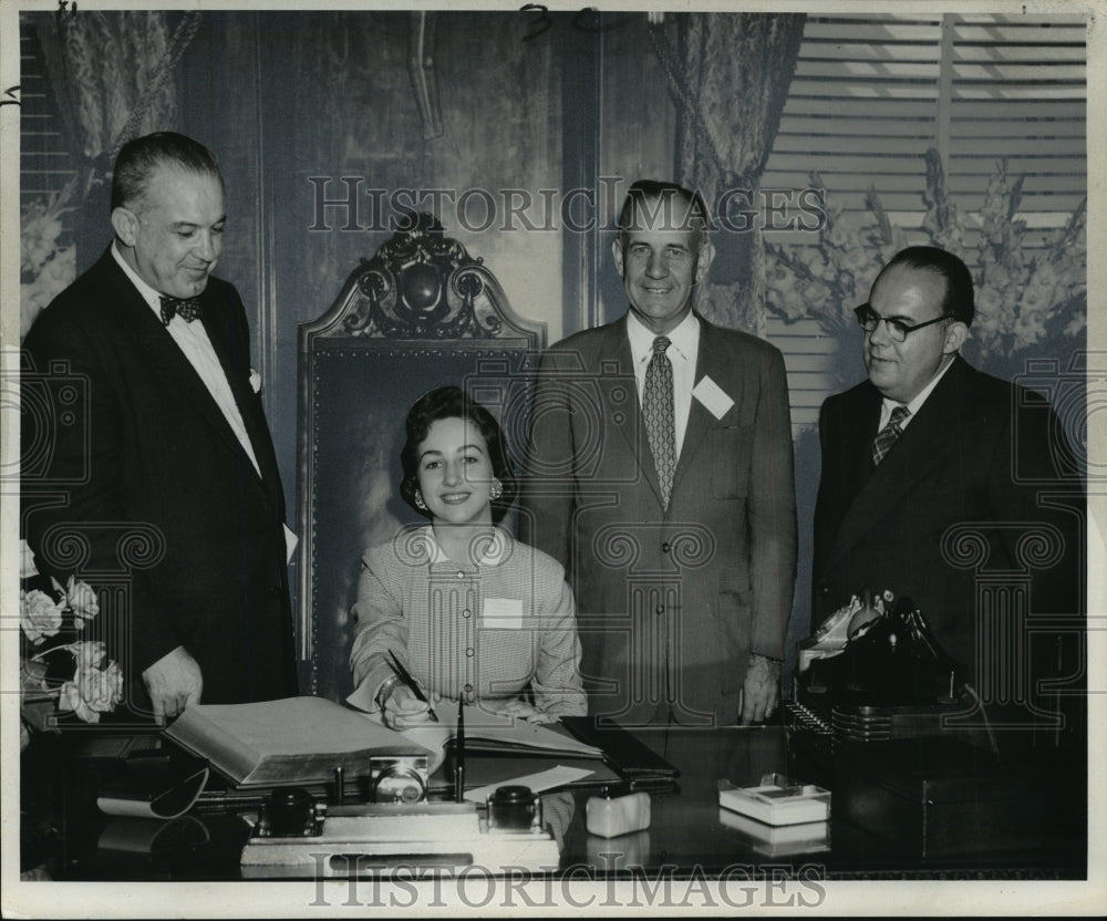 1955 Acadians-Miss Jeanette Patin of Breaux Bridge La. signs book. - Historic Images