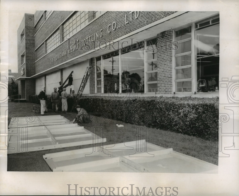 1956 Hurricane Flossy- Boarding windows in preparation of hurricane. - Historic Images