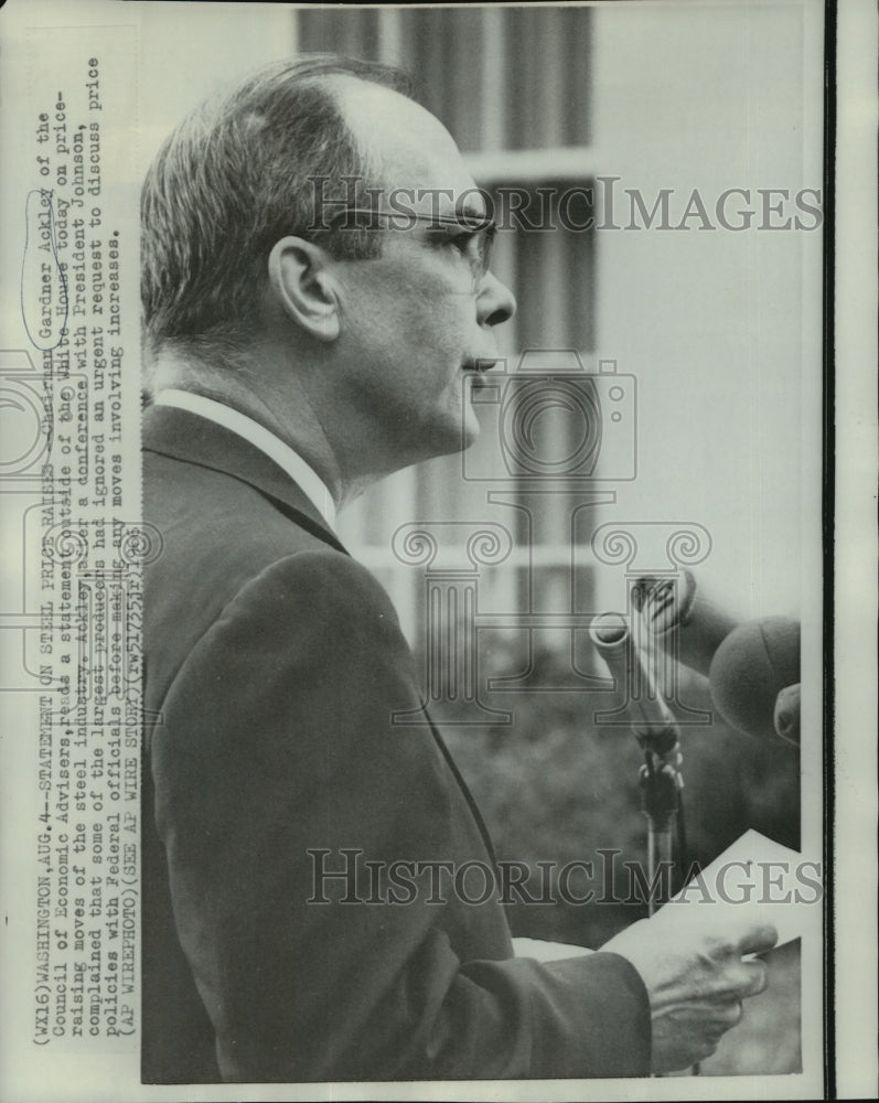 1966 Gardner Ackley reads a statement outside of the White House - Historic Images