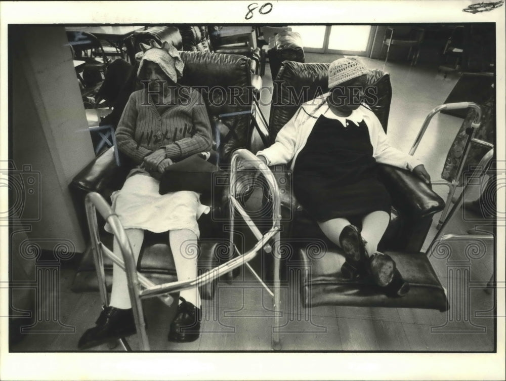 1980 Aged - Two elderly women relax in recliners. - Historic Images