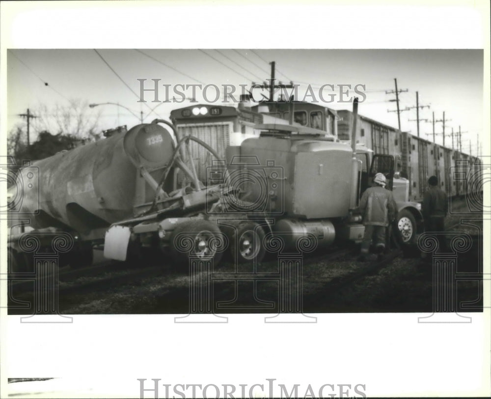 1994 Accidents - Firemen at the scene of train and truck wreck. - Historic Images