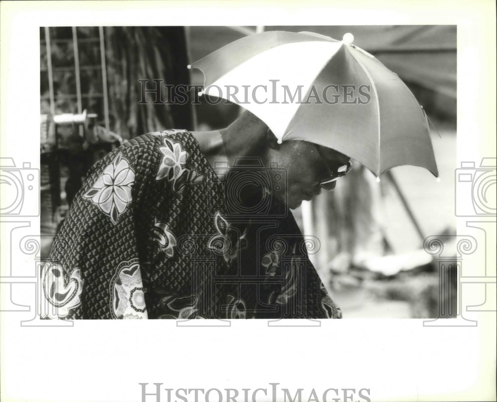 1995 Joe Landry Sports an Umbrella Hat at African Heritage Festival - Historic Images