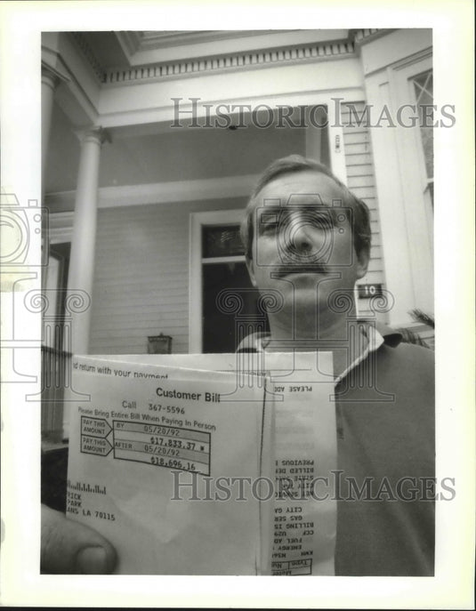 1992 Lance Africk with copy of very large NOPSI bill. - Historic Images