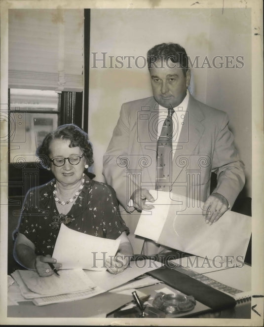 1953 Mrs. Alexnder, Lemuel Higgins at opening and inspection of bids - Historic Images