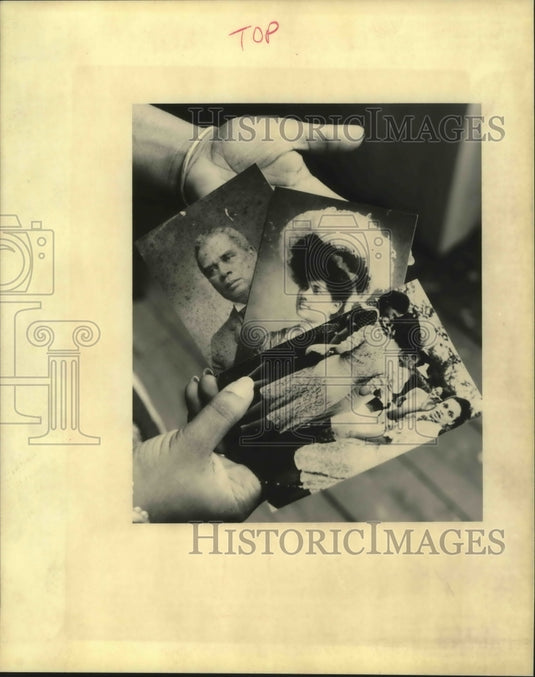 1995 Hambrick Holds Pictures That Will be Displayed at Museum - Historic Images