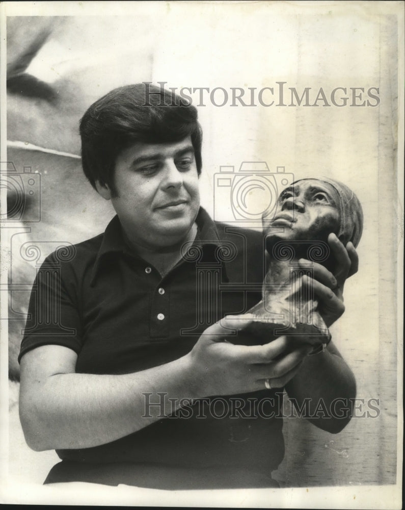 1973 Press Photo Haile Aguilar with items he collected around the world. - Historic Images