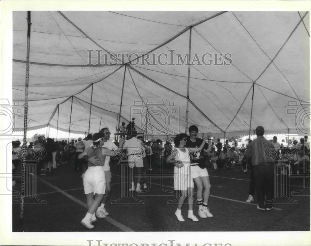 1992 Accordian Fest- Large dance floor and shade of a tent. - Historic Images