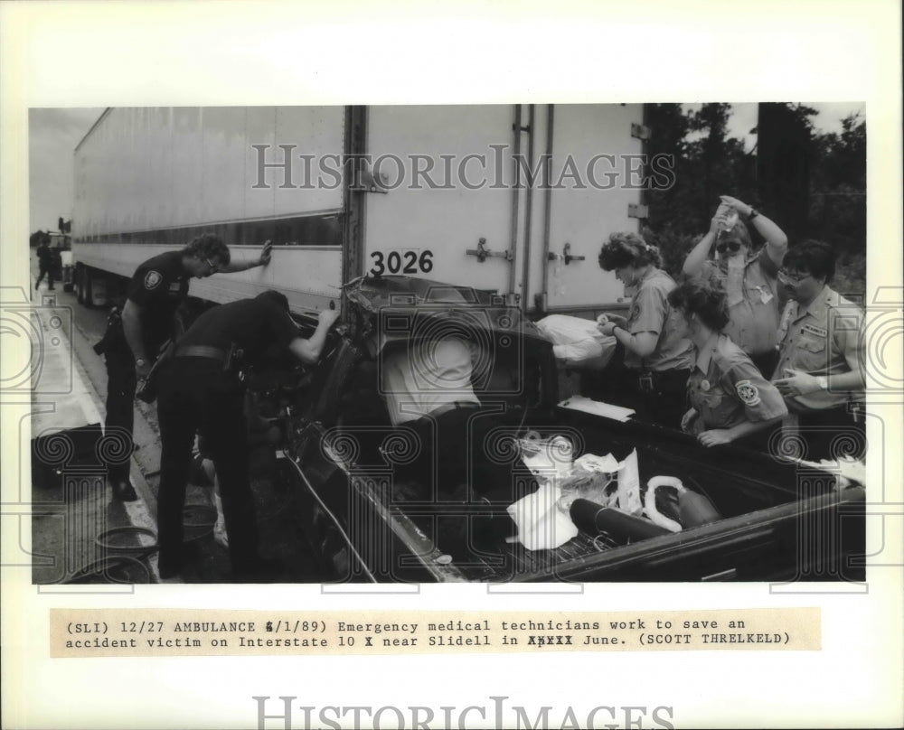 1989 New Orleans - Rescuers Work to Save Accident Victim on I-10 - Historic Images