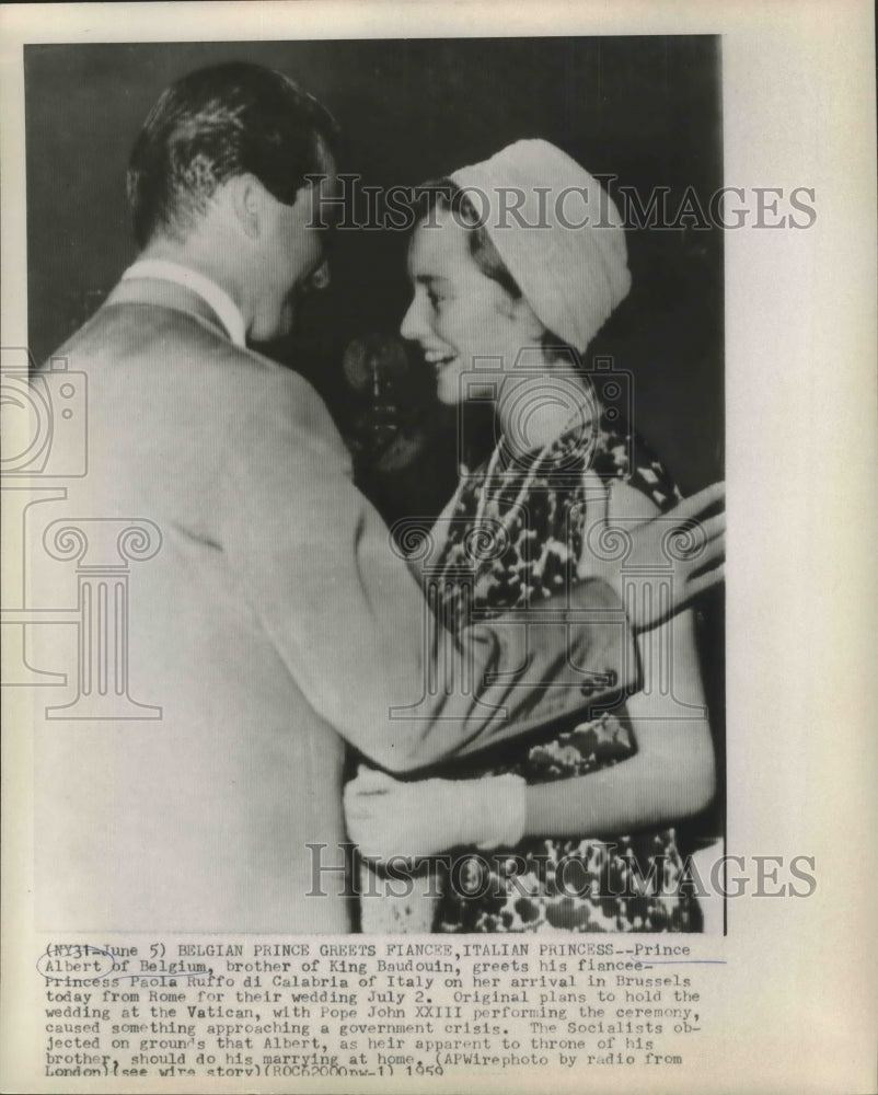 1959 Prince Albert of Belgium greets fiancee on arrival to Brussels - Historic Images