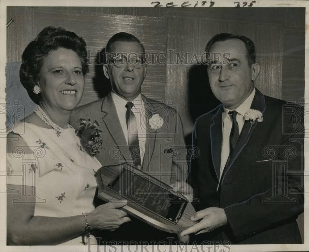 1961 Daniel A. Allain Jr., right receives plaque at dinner. - Historic Images