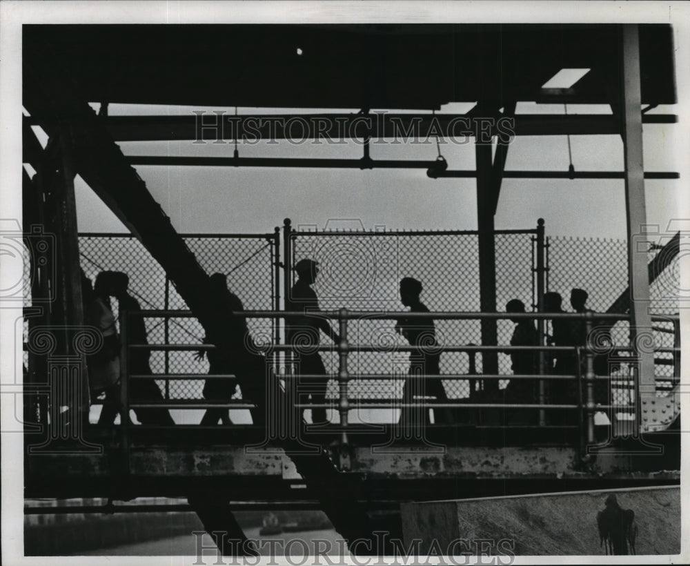 1966 Boarding and debarking passengers at the ferry landing. - Historic Images