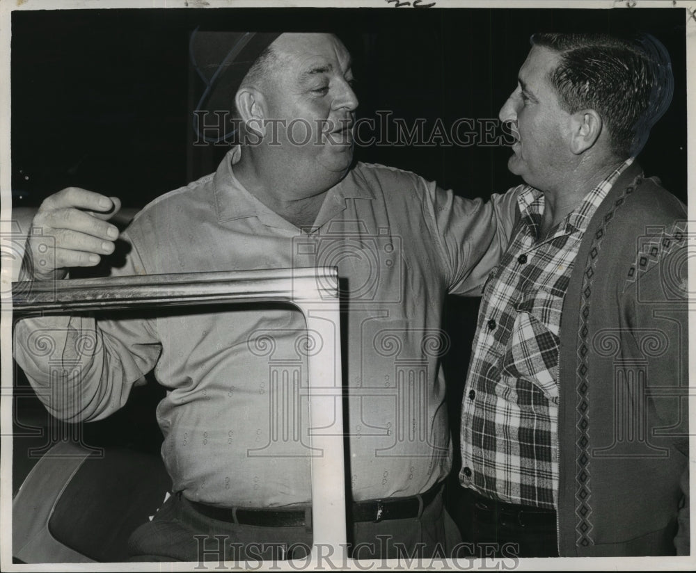 1964 Vic Fouquet and George Esteve discuss ferry schedule change. - Historic Images