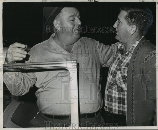 1964 Vic Fouquet and George Esteve discuss ferry schedule change. - Historic Images