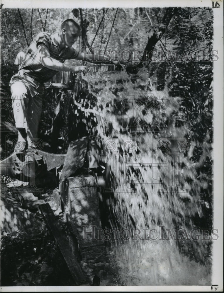 1960 Press Photo Archie Miller Batson Checks Water Flow - noa19628-Historic Images