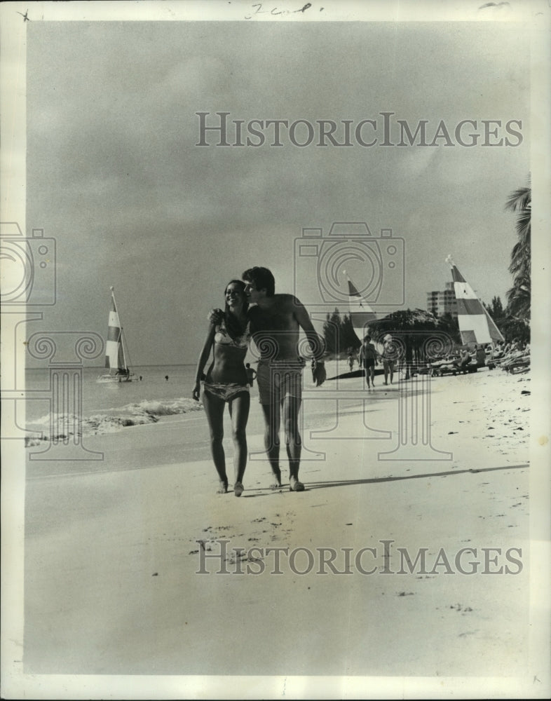 1972 Press Photo Couple on the Beach in Freeport, Bahamas - noa25667-Historic Images