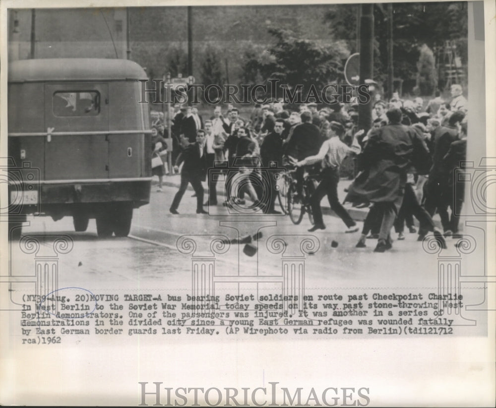 1962 Protesters toss stones to a bus bearing Soviets in West Berlin - Historic Images